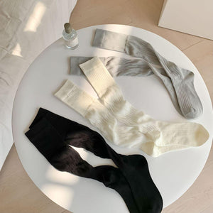 LIMISEVEN · Solid-Color Ribbed Mid-Calf Slouch Socks